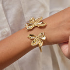 Gold-Tone Stainless Steel Sculptural Floral Jewelry Collection — styled view
