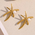 gold plated palm frond stud earrings with white pearl accents