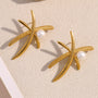 gold plated palm frond stud earrings with white pearl accents