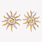two-tone spiral sunburst stud earrings isolated on white