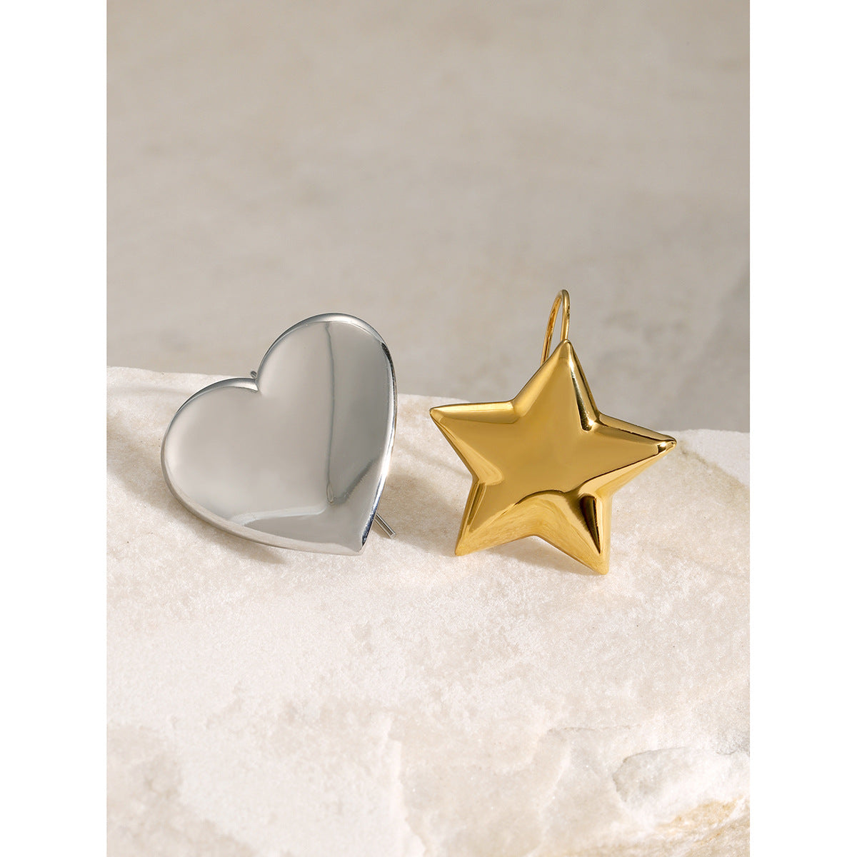 Heart and Star Stainless Steel Ring Collection shown on model