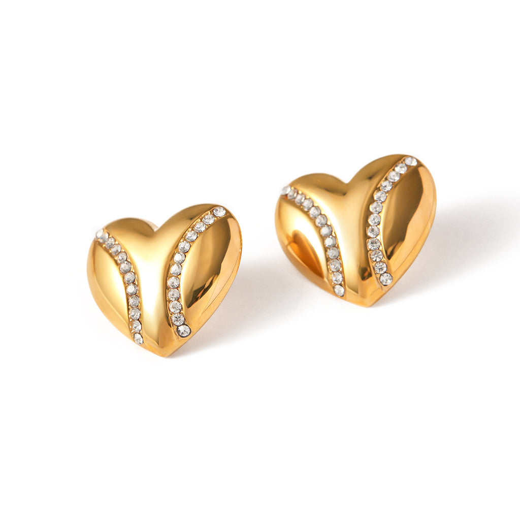 isolated sculptural heart stud earrings with clear accent rows