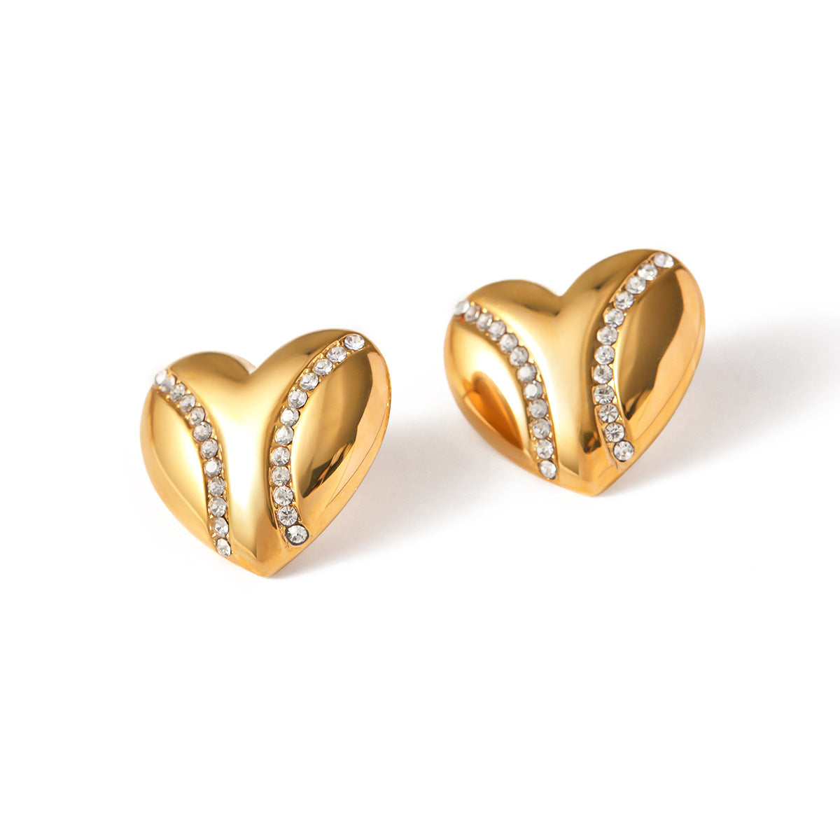 isolated sculptural heart stud earrings with clear accent rows