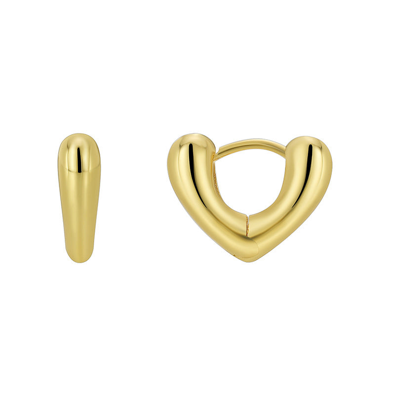 front and side views of gold plated heart huggie earrings