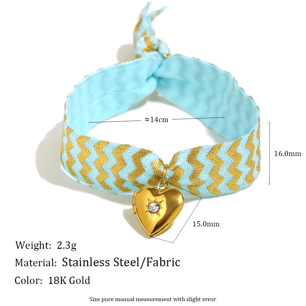 Blue Fabric Tie Bracelet with Gold Plated Stainless Steel Heart Locket — heart locket close-up