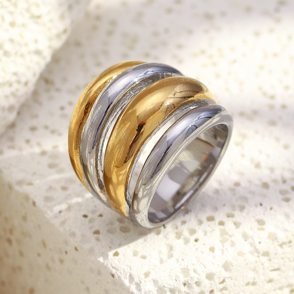 front angle of alternating gold plated and silver-finish rounded bands