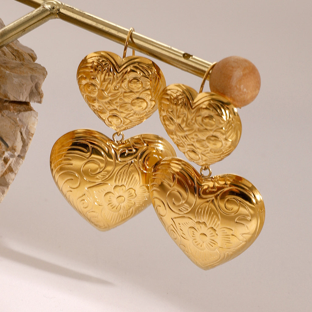 Gold-Tone Embossed Double Heart Stainless Steel Drop Earrings close-up product view