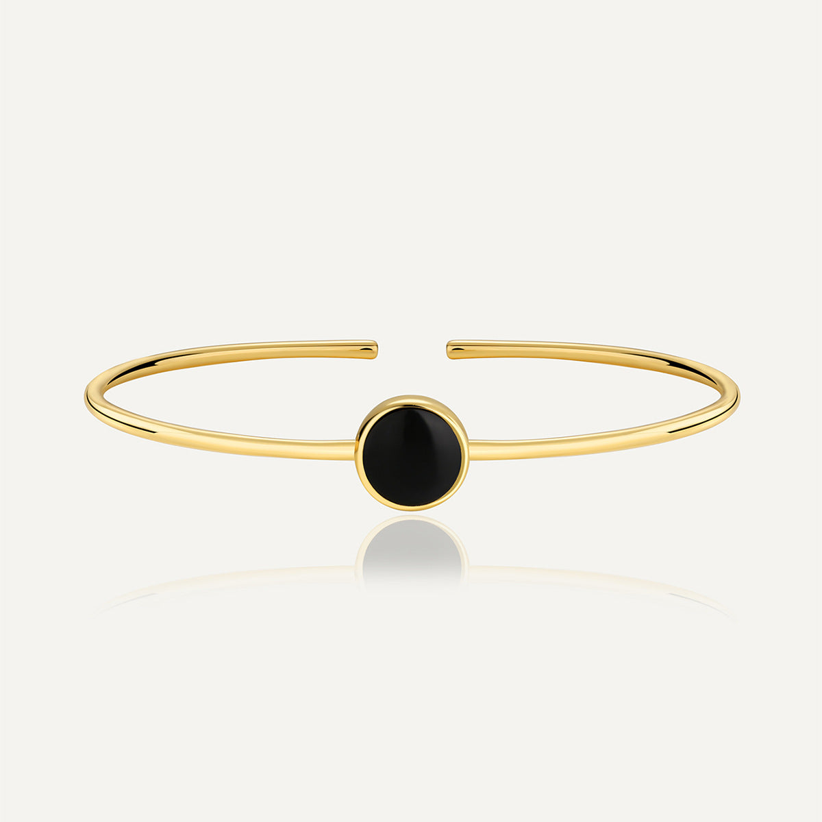 gold plated brass open bangle with round black agate cabochon