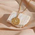 gold plated stainless steel coin pendant with pearl-style beads and clear stones