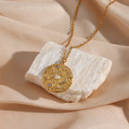 gold plated stainless steel coin pendant with pearl-style beads and clear stones