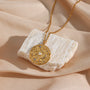 gold plated stainless steel coin pendant with pearl-style beads and clear stones