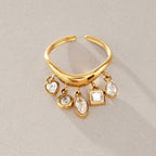 Curved open ring with five clear geometric charms