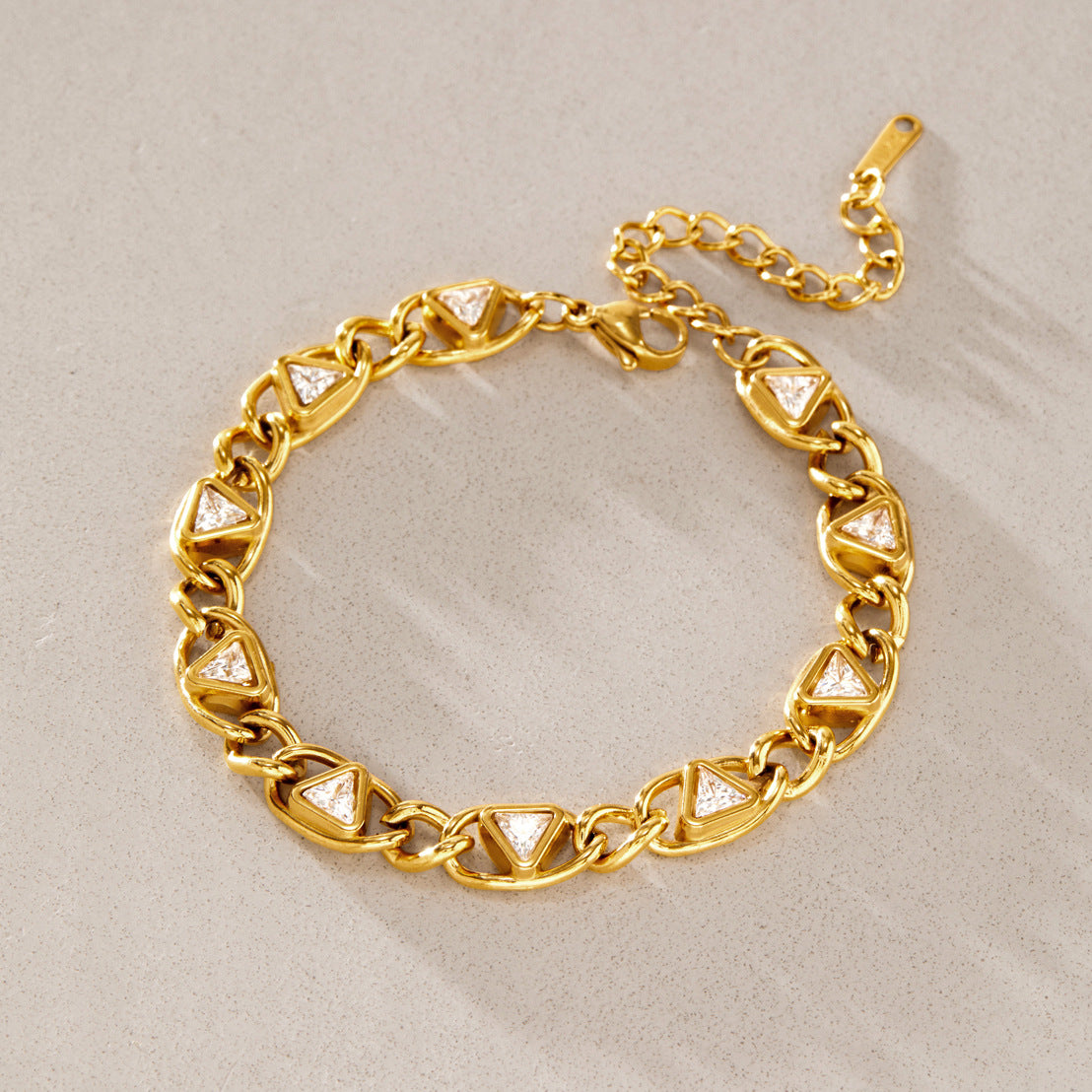 Triangle-accent chain bracelet on stone