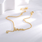 gold plated celestial anklet with staggered zirconia star line