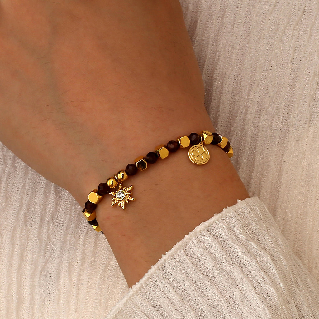 model wearing the gold plated brown bead sunburst bracelet