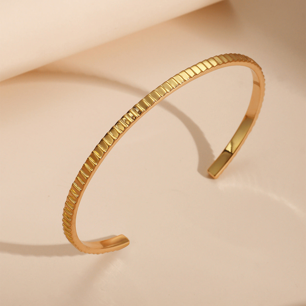 upright profile of the gold plated textured open cuff