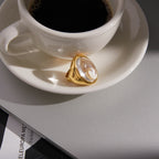 side view of gold plated stainless steel clear cabochon ring