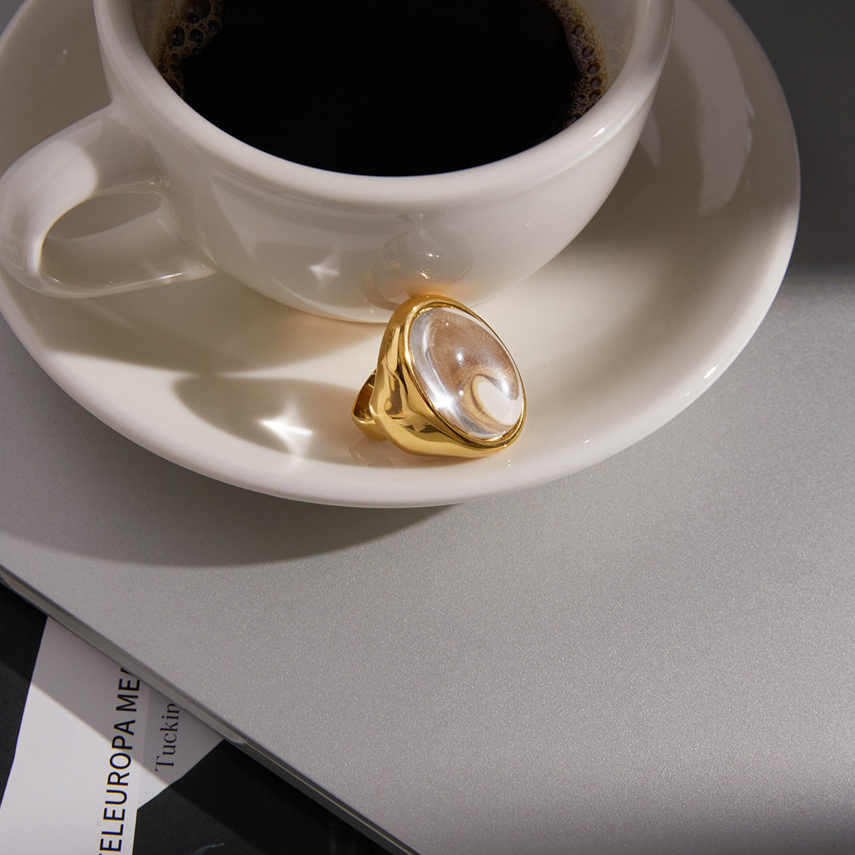 side view of gold plated stainless steel clear cabochon ring