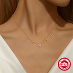 model in white wearing the zirconia butterfly station necklace