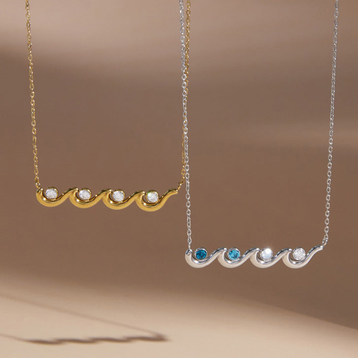 Two wave necklace color options on a display