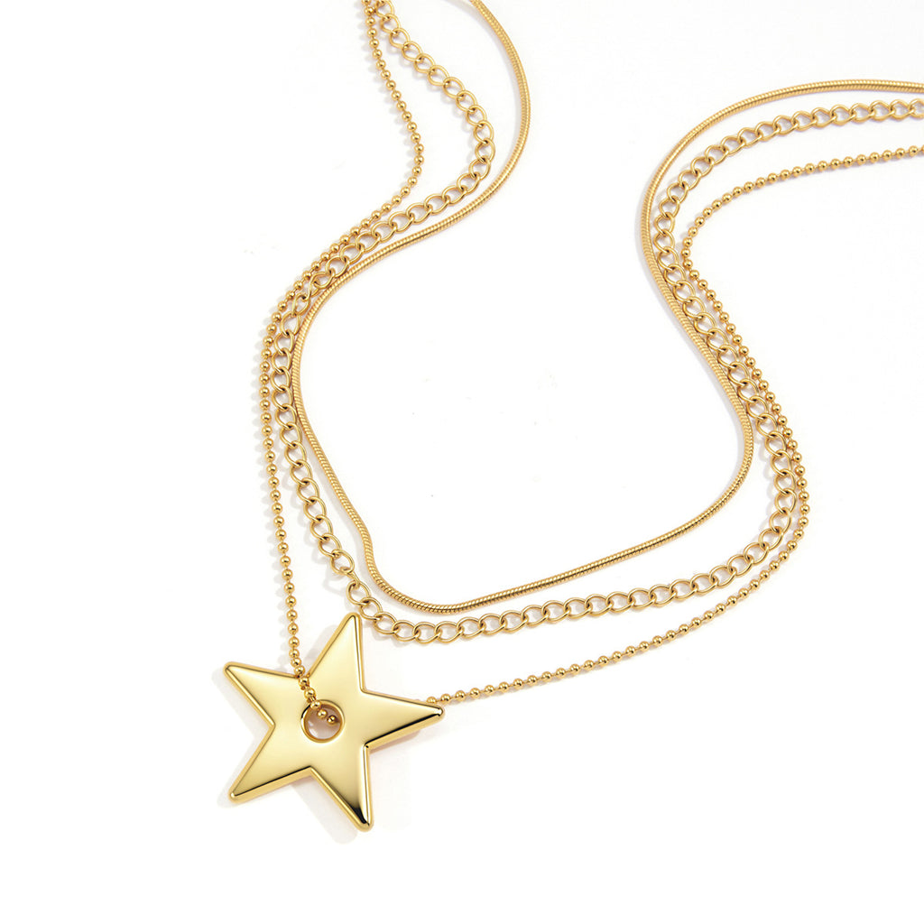 Three-chain star necklace on white background