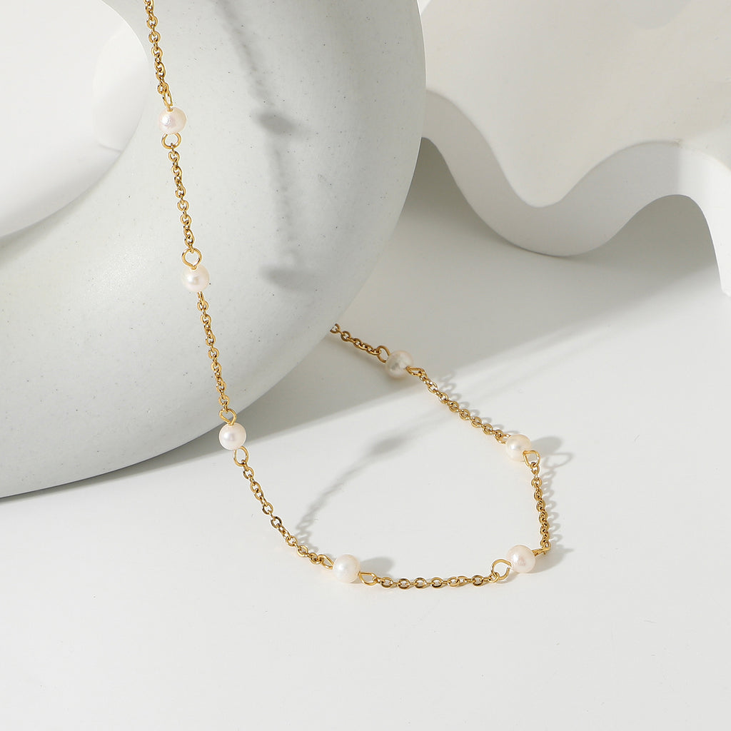 Fine gold-tone necklace showing separated freshwater pearls