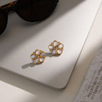 pair of lilac-pink pearlescent flower stud earrings
