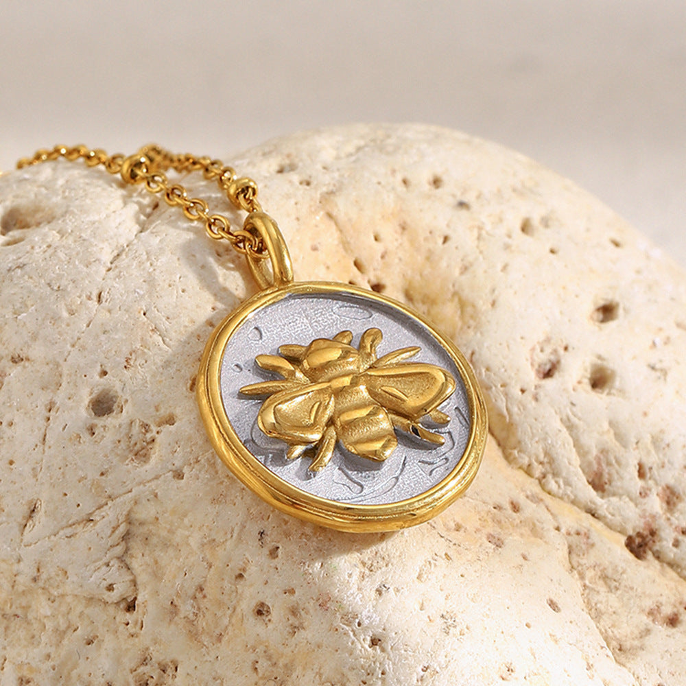 close view of raised bee and textured silver-finish medallion