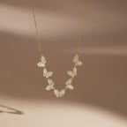 Single butterfly row necklace on a display bust
