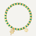 gold plated clover charm bracelet with green and gold beads