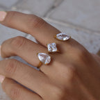 Pear square and oval ring worn across two fingers