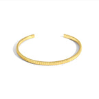 isolated top view of the minimalist ribbed open cuff bracelet