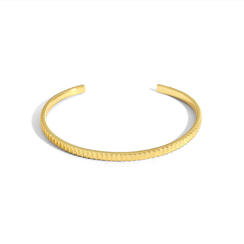 isolated top view of the minimalist ribbed open cuff bracelet