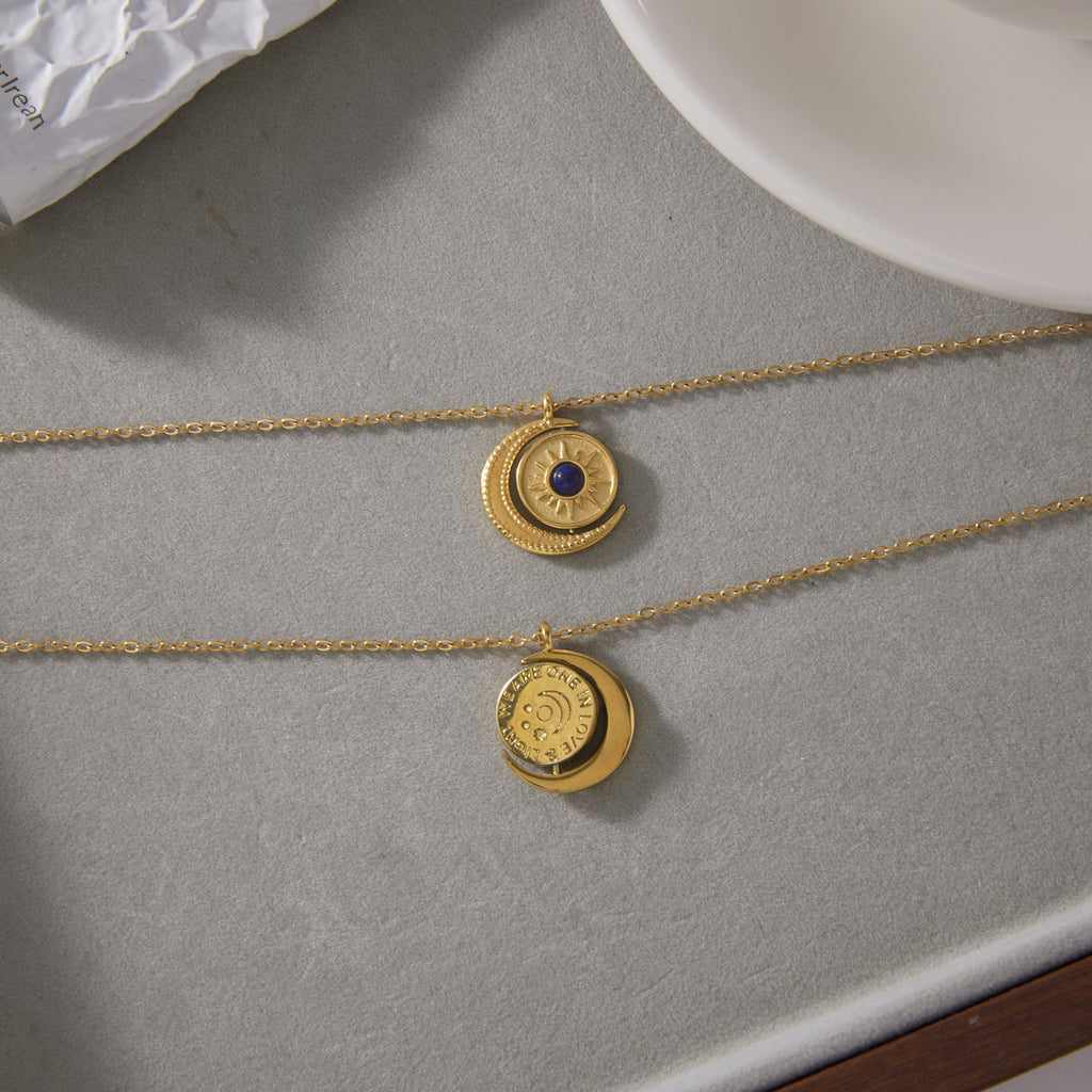 Front and reverse faces of rotating celestial pendant