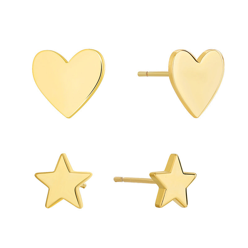 isolated gold plated heart and five-point star stud earring set
