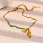 Gold Plated Stainless Steel Green Bead Seahorse and Shell Bracelet — full bracelet view