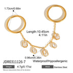 Two rings joined by a chain with clear drops