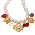 isolated front view of gold plated imitation pearl charm necklace