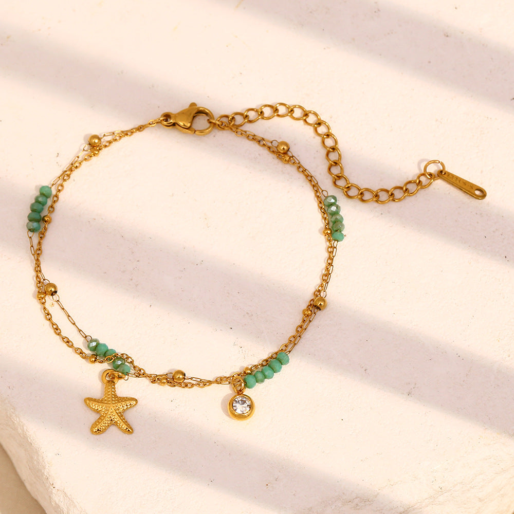 Gold Plated Stainless Steel Green Bead Starfish Double-Strand Bracelet — worn view