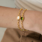 Oval bezel chain bracelets shown on a wrist