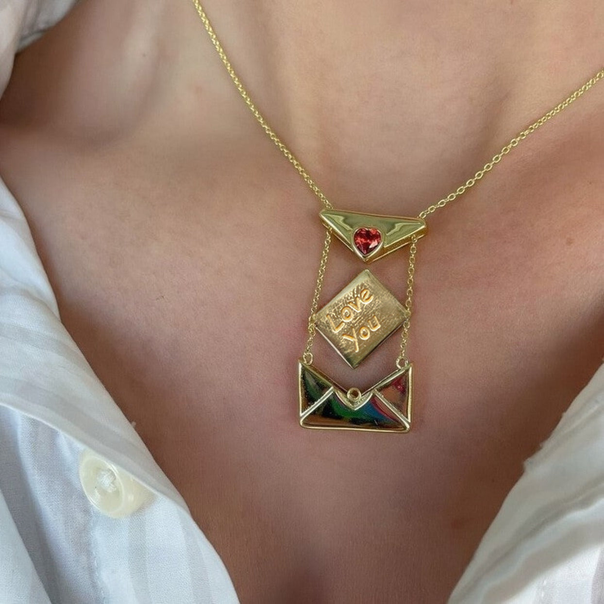 model wearing the open gold plated love letter heart necklace