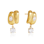Gold-tone double curved stud earrings on white