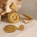 Spiral disc drop earrings displayed with a separate ring reference