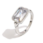 silver-finish stainless steel ring with a rectangular zirconia