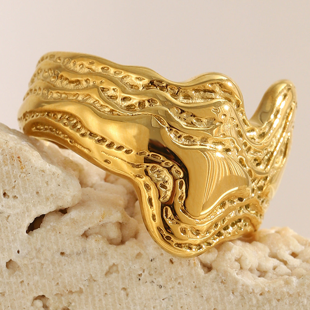 gold plated stainless steel statement ring with topographic wave texture