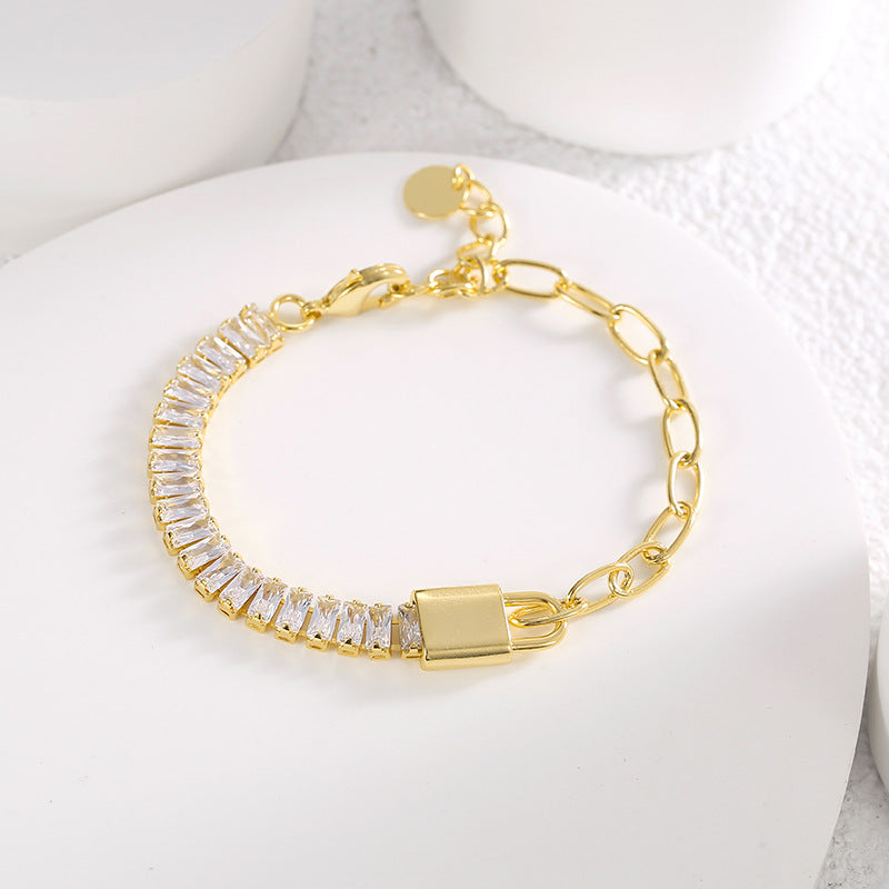 asymmetrical clear zirconia chain bracelet on a white display