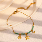 Gold Plated Stainless Steel Green Bead Starfish and Shell Bracelet — worn view