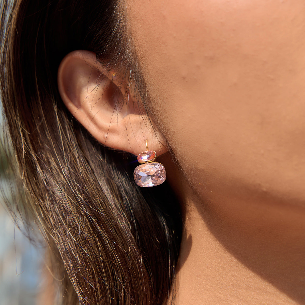 Pink cushion stone drop earring shown on model