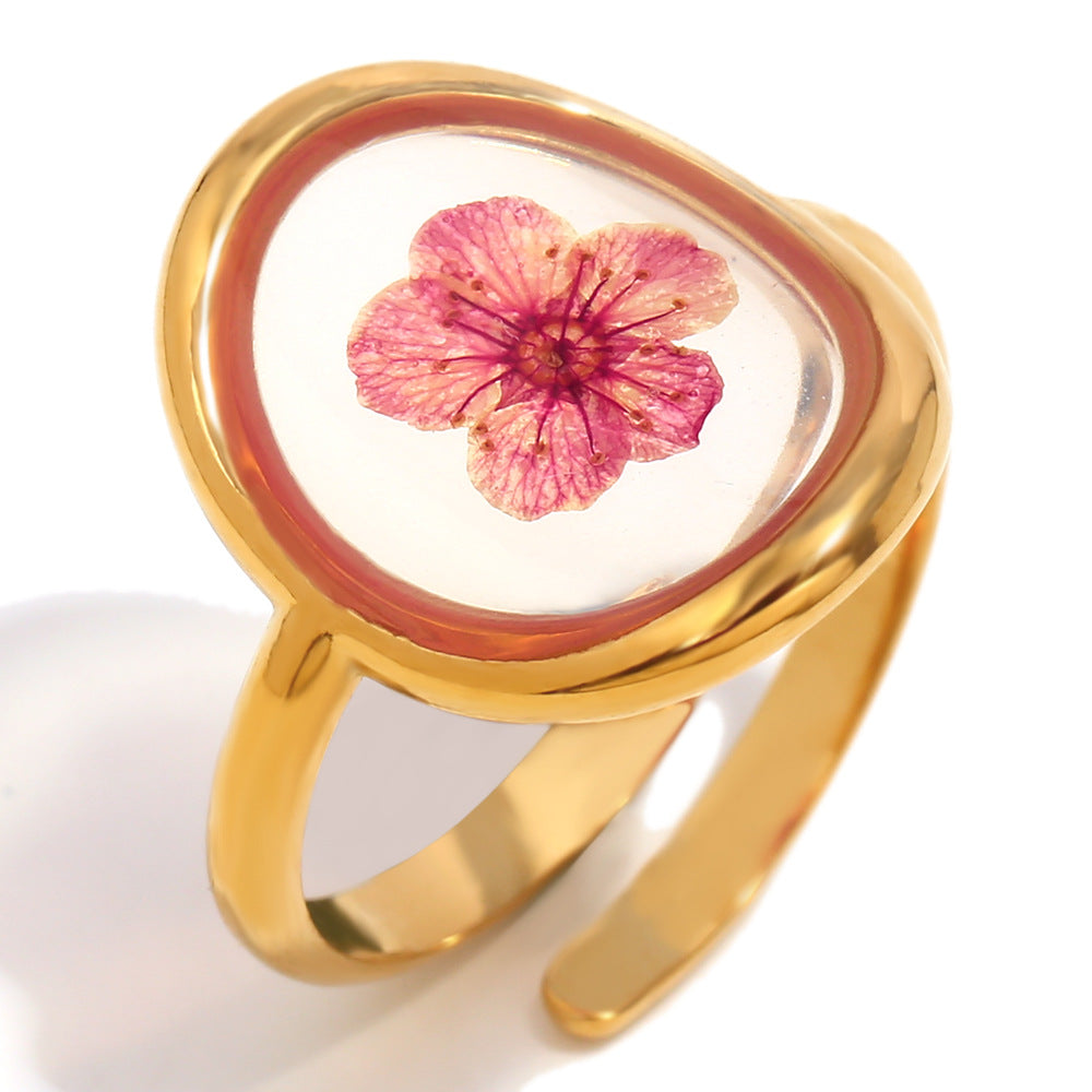 isolated close view of the red flower beneath a clear domed insert