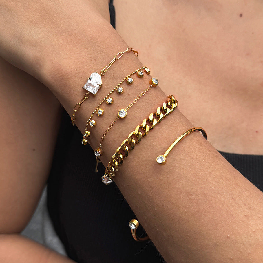 Mixed chain textures and solitaire accents worn together